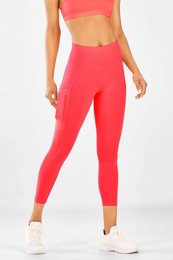 Mila High-Waisted Capri Legging With Pocket in Pop Coral | Fabletics